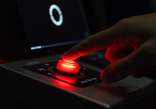 Person pressing a button in a simple reaction time test.