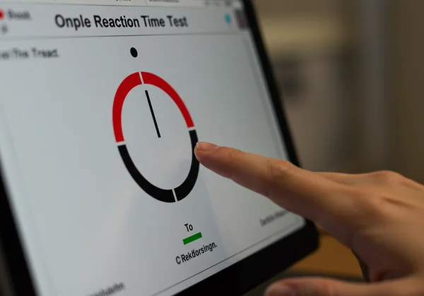 Person practicing on an online reaction time test website